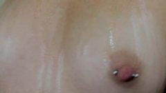 Rubbing Oil On My Tinie Pierced Boobs
