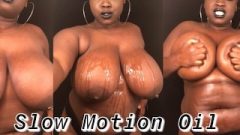 Slow Motion Chunky Rubbing Oil On Massive Natural Boobs & Body